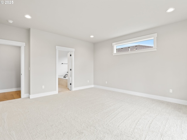 2891 NE Currin Creek Dr, Estacada, OR 97023 - unfurnished bedroom featuring ensuite bathroom, light carpet, baseboards, and recessed lighting