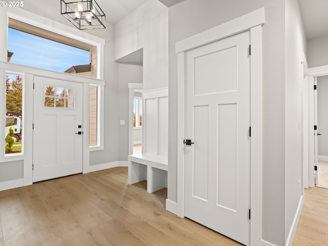2891 NE Currin Creek Dr, Estacada, OR 97023 - foyer with baseboards, an inviting chandelier, and light wood-style flooring