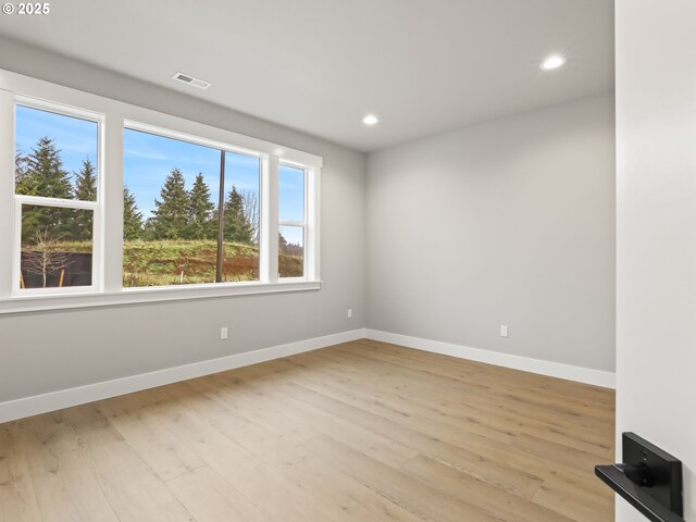 2891 NE Currin Creek Dr, Estacada, OR 97023 - spare room featuring light wood-style floors, visible vents, baseboards, and recessed lighting