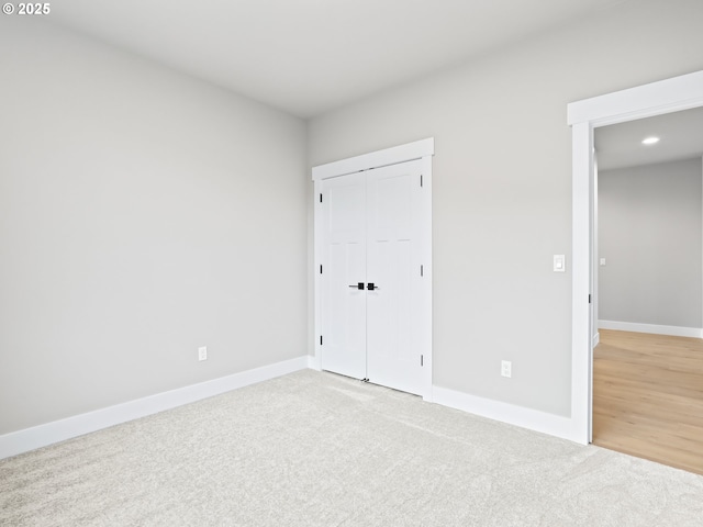 2891 NE Currin Creek Dr, Estacada, OR 97023 - unfurnished bedroom with carpet, a closet, baseboards, and recessed lighting