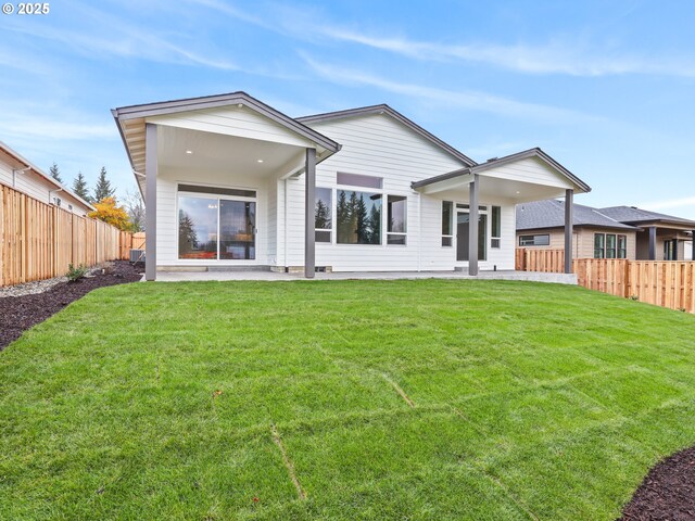 2891 NE Currin Creek Dr, Estacada, OR 97023 - rear view of property featuring a yard, a fenced backyard, and a patio