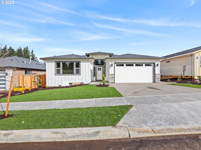 2891 NE Currin Creek Dr, Estacada, OR 97023 - prairie-style house with an attached garage, fence, a front lawn, board and batten siding, and driveway