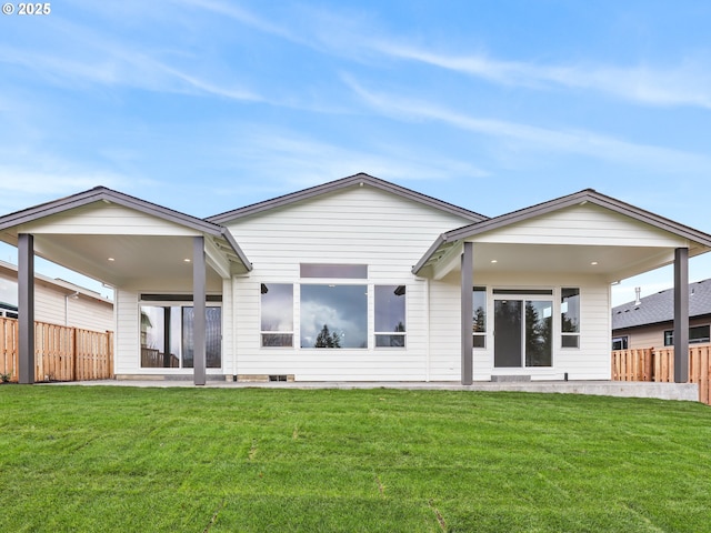2891 NE Currin Creek Dr, Estacada, OR 97023 - back of house featuring fence, a patio area, and a lawn