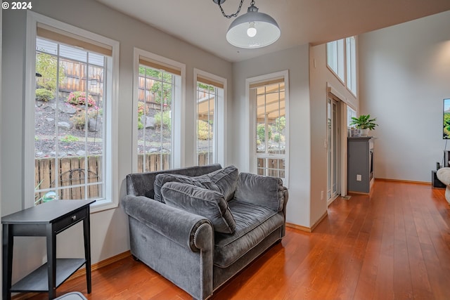 living area with hardwood / wood-style flooring