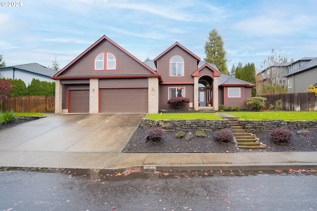 front of property with a front lawn and a garage