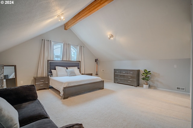 carpeted bedroom with lofted ceiling with beams and a textured ceiling