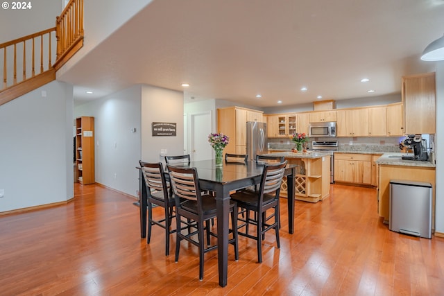 dining area with light hardwood / wood-style floors