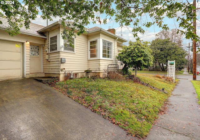 view of property exterior featuring a garage