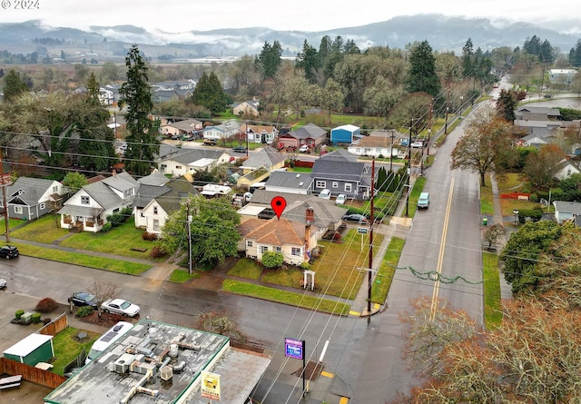 drone / aerial view featuring a mountain view