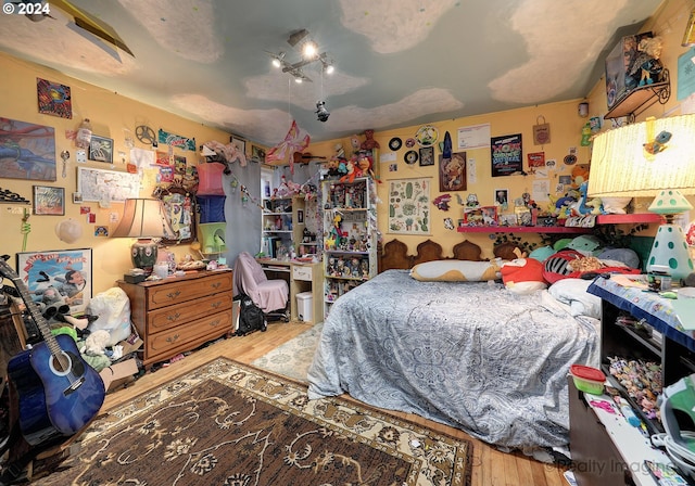 bedroom featuring hardwood / wood-style floors