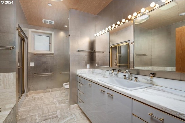 bathroom featuring walk in shower, a bidet, vanity, and toilet