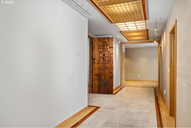 hall with light tile patterned flooring