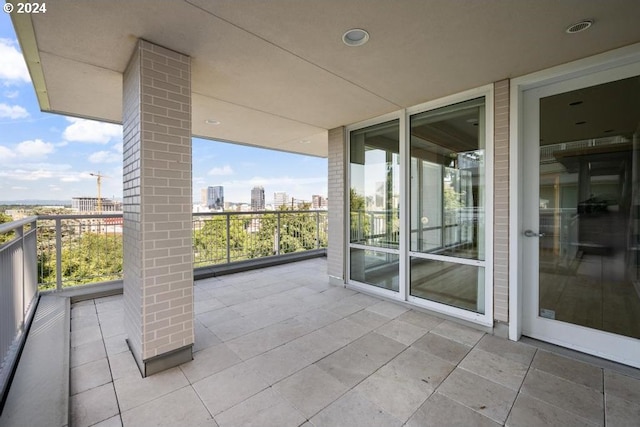 view of patio featuring a balcony