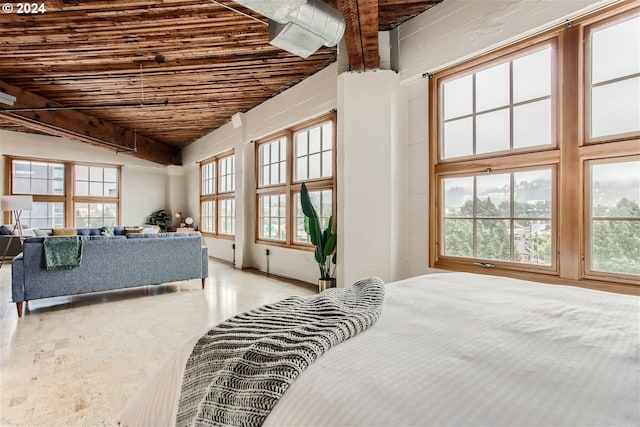 bedroom featuring vaulted ceiling and wooden ceiling