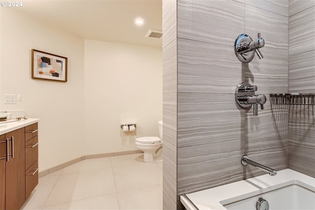 bathroom featuring tile flooring, toilet, and vanity