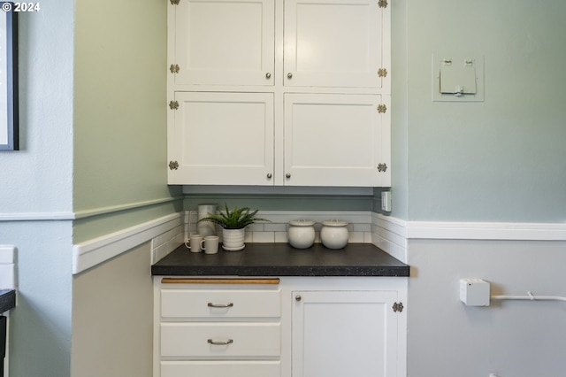 bar featuring white cabinetry