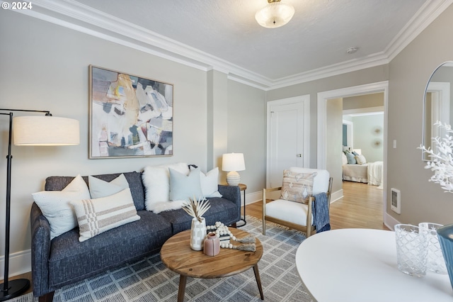 living room featuring crown molding and hardwood / wood-style floors