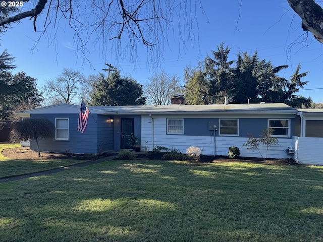 ranch-style house with a front lawn