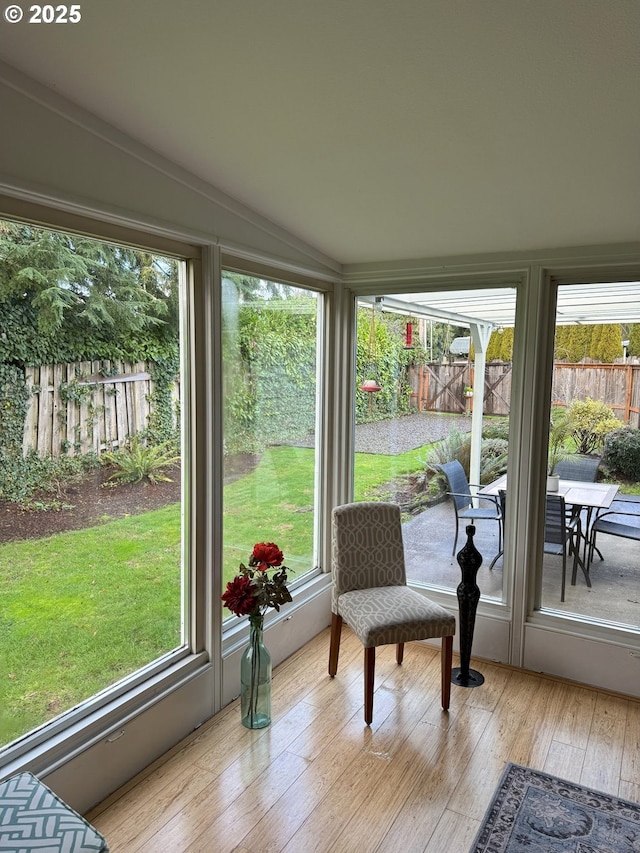 sunroom / solarium with vaulted ceiling