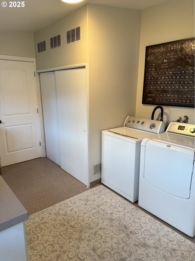 laundry room with light carpet and independent washer and dryer