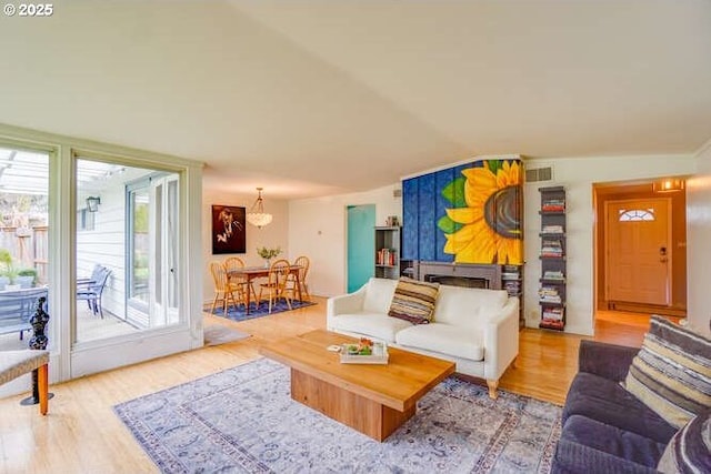 206 Farview Dr, Vancouver, WA 98661 - living room featuring vaulted ceiling, wood finished floors, and visible vents