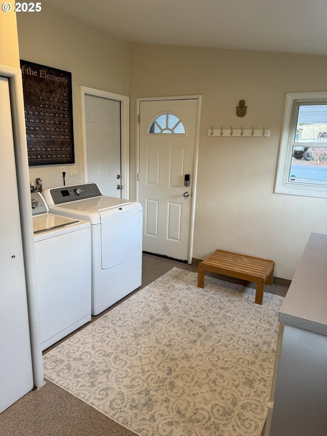 washroom with washer and dryer