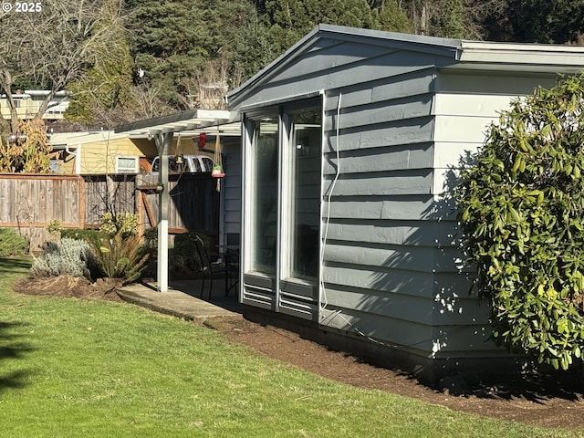 view of outbuilding with a yard