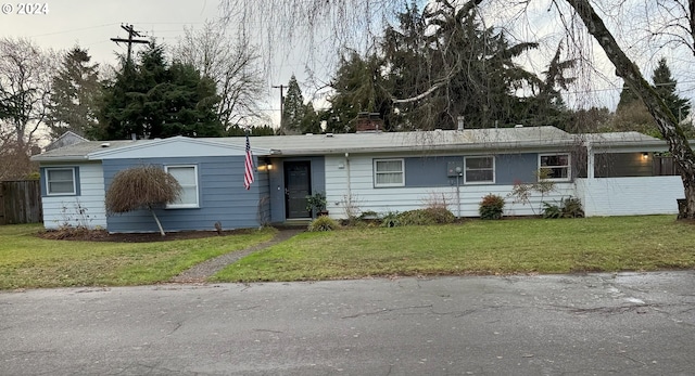 ranch-style home with a front yard