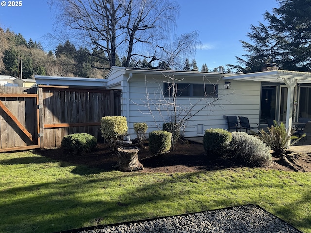 view of home's exterior with a lawn