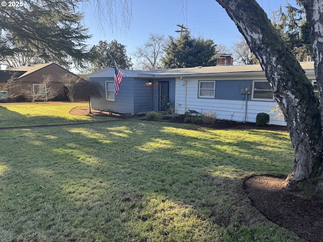 ranch-style house with a front lawn