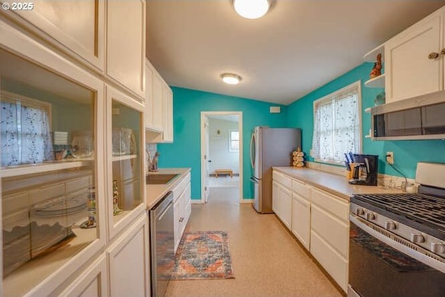 206 Farview Dr, Vancouver, WA 98661 - kitchen with a sink, appliances with stainless steel finishes, light countertops, and white cabinetry