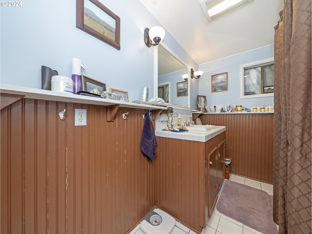 bathroom with tile patterned flooring and vanity