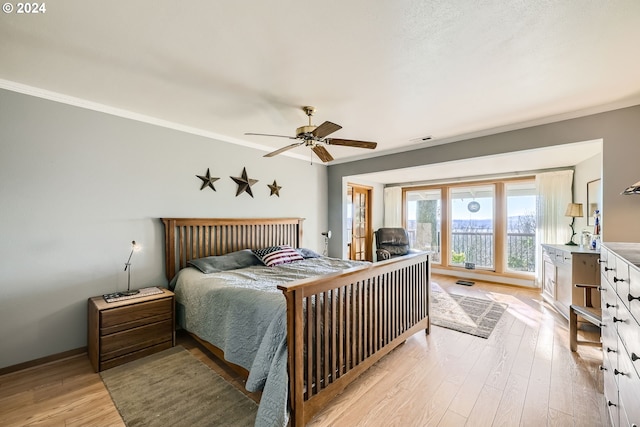 bedroom featuring ornamental molding, ceiling fan, and light hardwood / wood-style floors