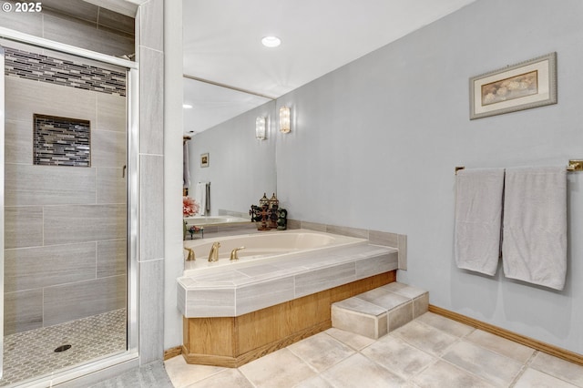 bathroom with separate shower and tub and tile patterned floors