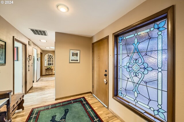 doorway to outside with light hardwood / wood-style flooring