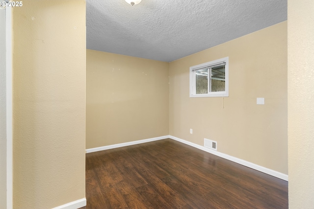 213 Engle Ave, Molalla, OR 97038 - empty room featuring dark wood finished floors and a textured ceiling