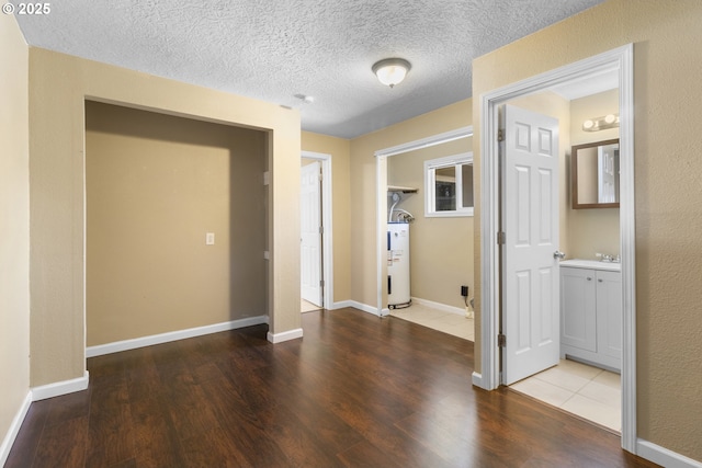 213 Engle Ave, Molalla, OR 97038 - corridor featuring electric water heater and wood finished floors