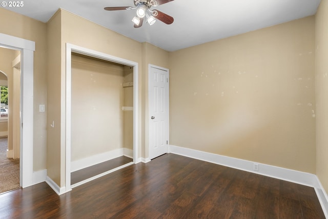 213 Engle Ave, Molalla, OR 97038 - unfurnished bedroom featuring dark wood finished floors, arched walkways, and a closet