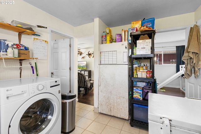 213 Engle Ave, Molalla, OR 97038 - washroom with washer / clothes dryer and light tile patterned floors