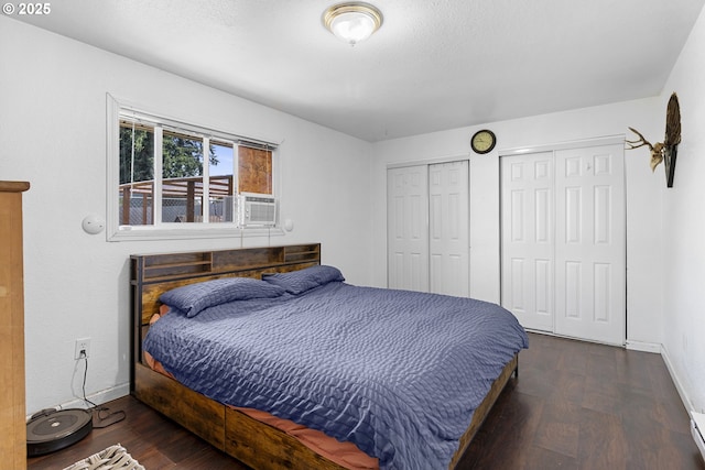 213 Engle Ave, Molalla, OR 97038 - bedroom featuring two closets, wood finished floors, and cooling unit