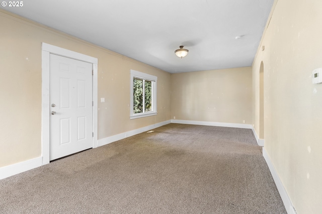 213 Engle Ave, Molalla, OR 97038 - empty room with carpet, arched walkways, and crown molding