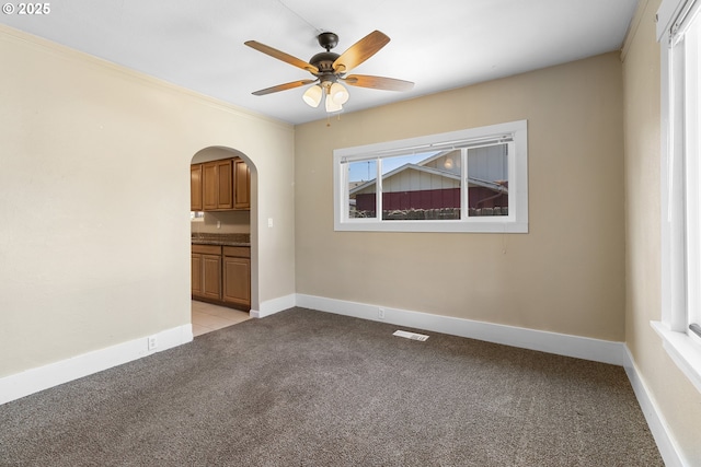 213 Engle Ave, Molalla, OR 97038 - spare room with arched walkways, light carpet, and a ceiling fan