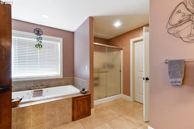 bathroom featuring independent shower and bath and tile patterned floors