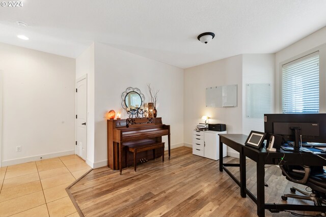 office with light hardwood / wood-style floors