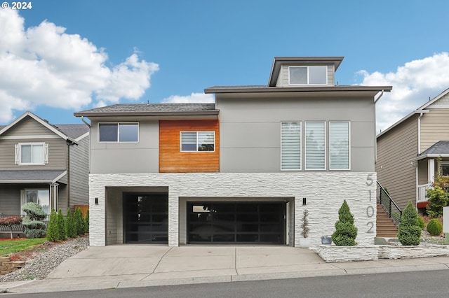 view of front of property featuring a garage