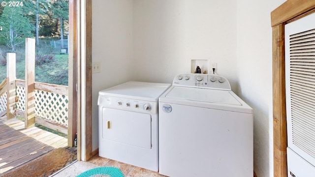 washroom with washer and dryer