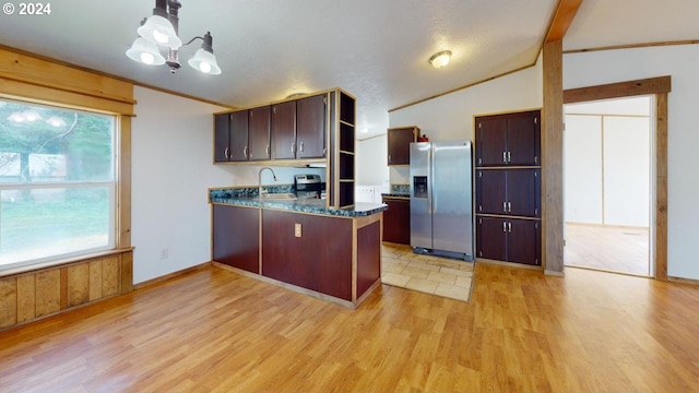 kitchen with appliances with stainless steel finishes, dark brown cabinets, sink, lofted ceiling with beams, and light hardwood / wood-style floors