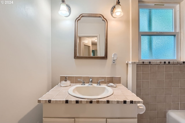 bathroom with plenty of natural light and vanity