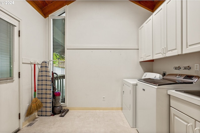 laundry area featuring hookup for an electric dryer, washing machine and dryer, cabinets, light carpet, and wooden ceiling