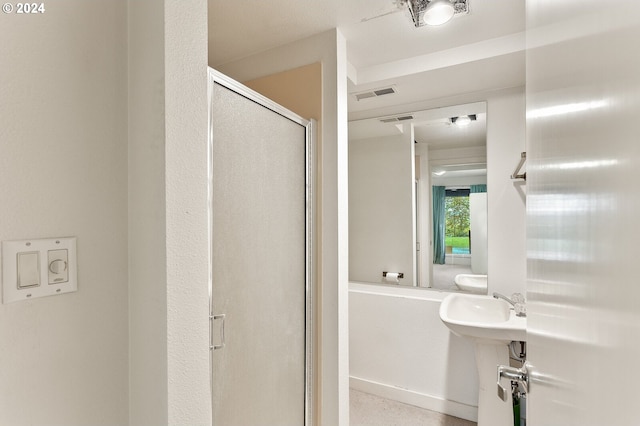 bathroom with a shower with shower door